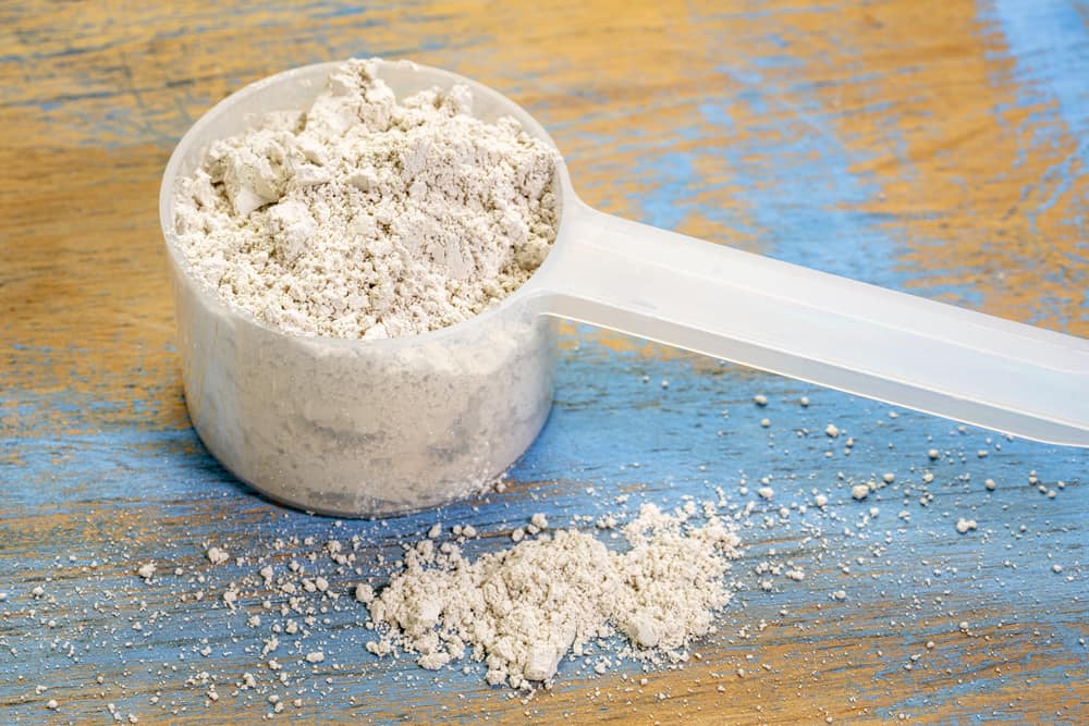 food grade diatomaceous earth supplement - scoop of powder